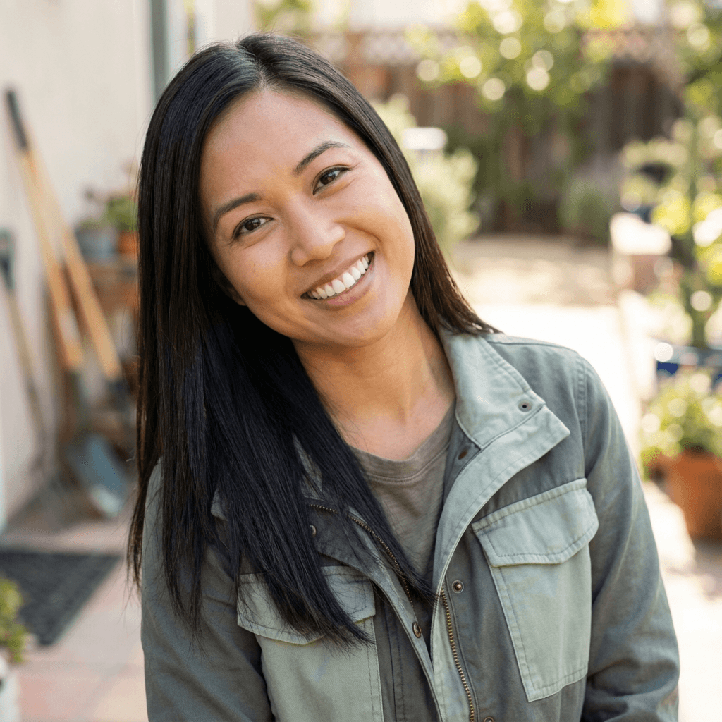 Emily Chen, retail owner, in a casual blazer near store shelves